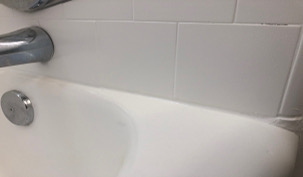 Tub and Shower re-grout, new fixtures, resurface